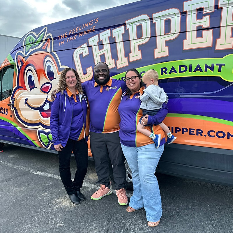 Some of the Chipper Plumbing & Radiant team standing next to the Chipper van